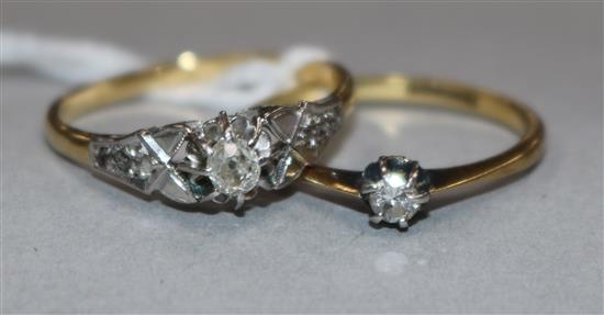 An 18ct gold single stone diamond ring with diamond set shoulders and an 18ct gold and solitaire diamond ring.